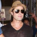 Brad Pitt Shows Off His New 'Do At The Airport