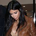 Kim Kardashian Shows Off Her Pregnancy Curves When She Catches Flight To New Orleans