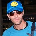 Chris Martin Arrives At LAX In A Great Mood
