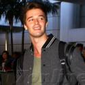 Patrick Schwarzenegger Flashes A Smile At LAX