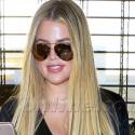 Khloe's Face Shines As She Jets Out Of LAX