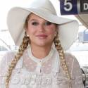 Kesha Stuns In A White Lace Bodysuit At LAX
