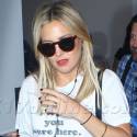 Kate Hudson Wears "Wish You Were Here" T-Shirt At The Airport