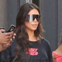 Kim Kardashian Rocks A Pablo T-Shirt Dress And Baggy Leather Thigh Highs In NYC