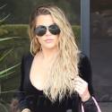 Khloe Kardashian Flaunts Her New Size 4 Frame In A Tight Tracksuit