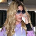 Kim Zolciak Tries To Hide Her Plumped Up Lips At LAX