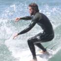 Liam Hemsworth Risks A Shark Attack In Malibu