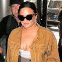 Demi Lovato Wears A Crop Top And High Waisted Pants At LAX