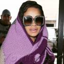Cardi B Covers Her Baby Bump At LAX