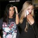 Kourtney Kardashian Looks Edgy In A Pink Floyd T-Shirt And Snakeskin Boots