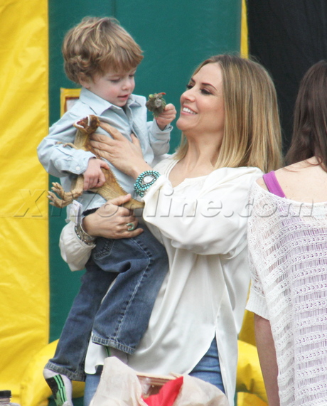 sunglasses blonde Brooke Mueller charlie sheen party jeans bell bottoms eating presents 