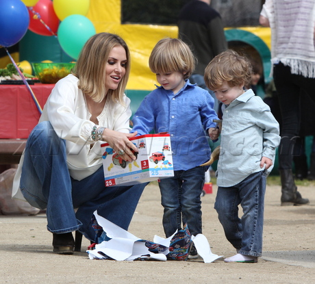 sunglasses blonde Brooke Mueller charlie sheen party jeans bell bottoms eating presents 