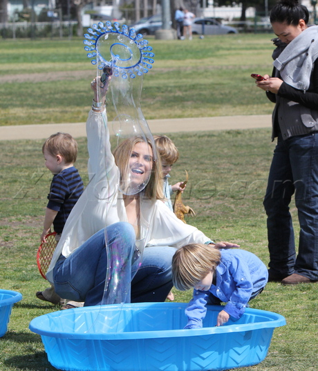 sunglasses blonde Brooke Mueller charlie sheen party jeans bell bottoms eating presents 