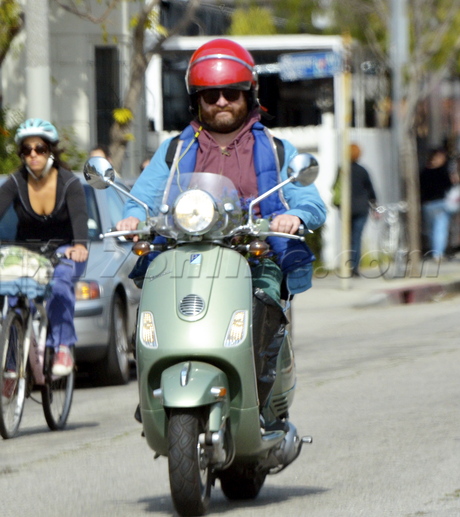 Zach Galifianakis sunglasses vespa scooter flowers 