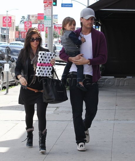 Kourtney Kardashian sunglasses boots pregnant present joans on third 