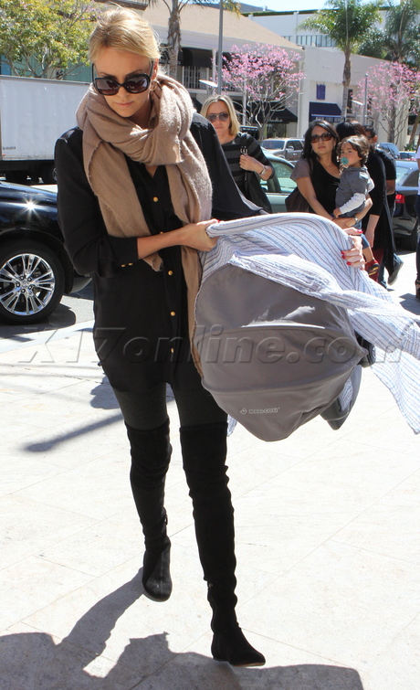 Charlize Theron  Bouchon  sunglasses blanket baby carrier 