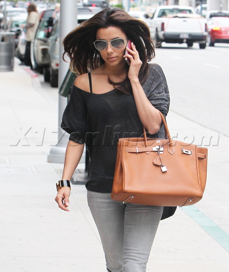 Eva Longoria spa smoking cigarette hand bag 