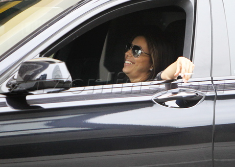 Eva Longoria spa smoking cigarette hand bag 