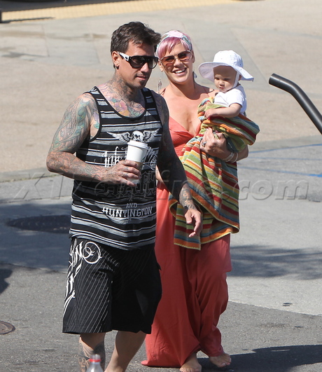 Carey Hart Pink golf cart pink hair sunglasses tattoo willow 