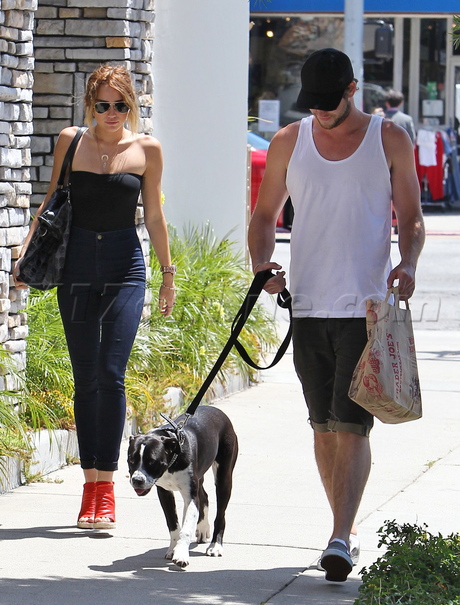 Miley Cyrus Liam Hemsworth Studio City dog tube top jeans adoption 