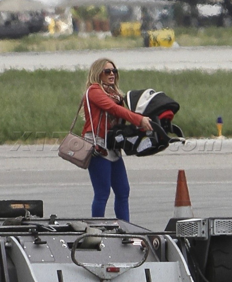 sunglasses Hilary Duff jeans airport leather jacket purse 