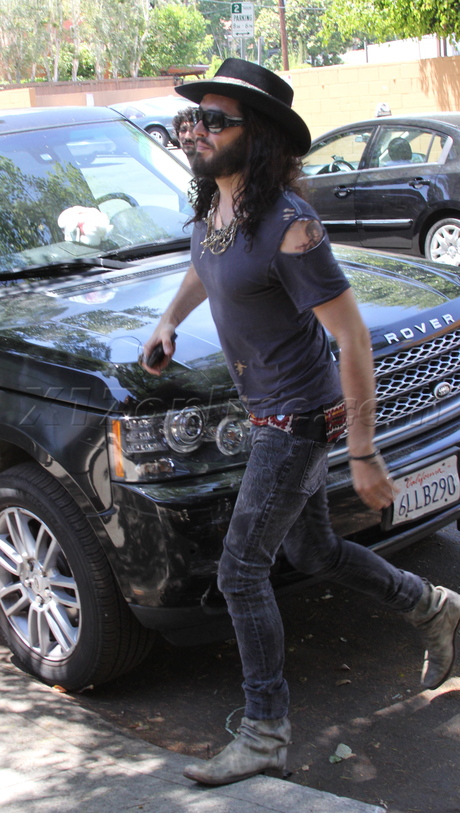 Russell Brand hat sunglasses jeans ripped shirt katy perry