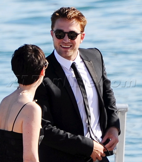 cannes film festival on the road Robert Pattinson suit boat 