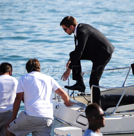 cannes film festival on the road Robert Pattinson suit boat 