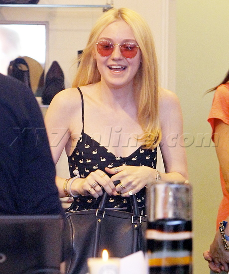 Dakota Fanning purse shopping print dress heels sunglasses 