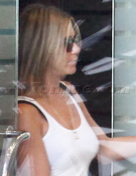 Jennifer Aniston white tank top white pants sunglasses spa flats 