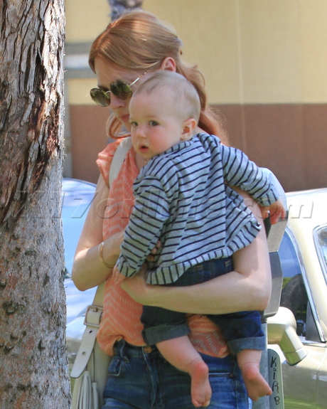 sunglasses January Jones  red hair baby jeans blouse 