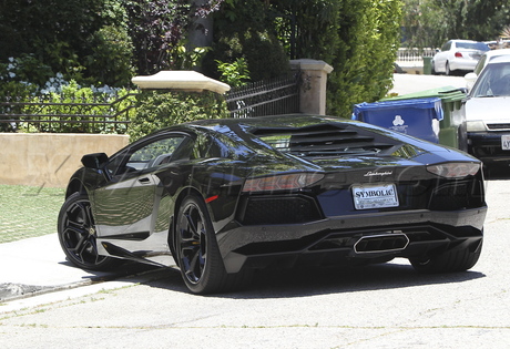 Kim Kardashian  leather  Louboutins   jeans Lamborghini  