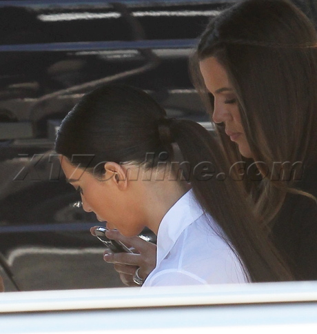 Kim Kardashian  Khloe Kardashian  reality show filming taping golf cart make up bad make up tight jeans reality 