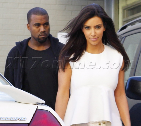 phone Kim Kardashian heels white top hair reality kanye west laser away rolls royce range rover