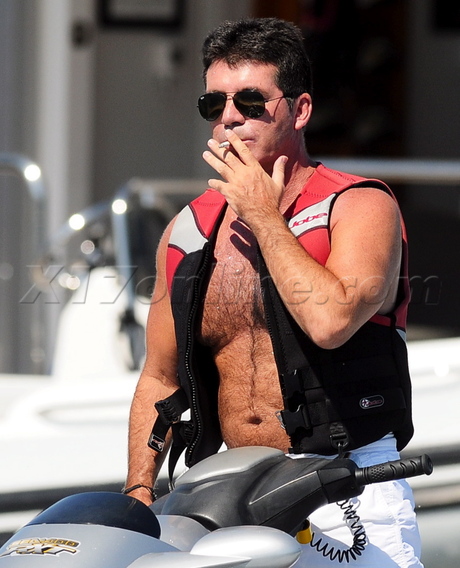 Simon Cowell shirtless vest water scooter jet ski waverunner smoking cigarette american idol x factor sunglasses saint tropez france hairy chest