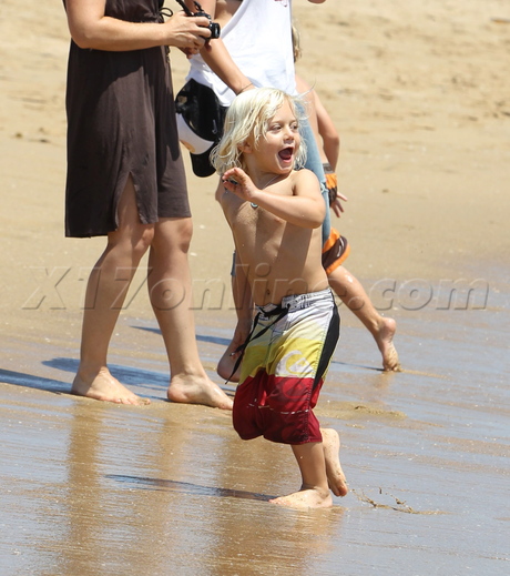 Gwen Stefani bright color skirt beach zuma kingston hat sunglasses 