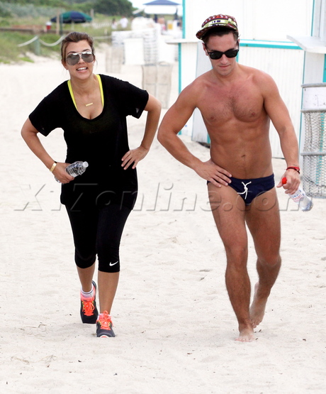 sunglasses Kourtney Kardashian work out bottled water tights spandex beach trainer baby weight reality tv speedo 
