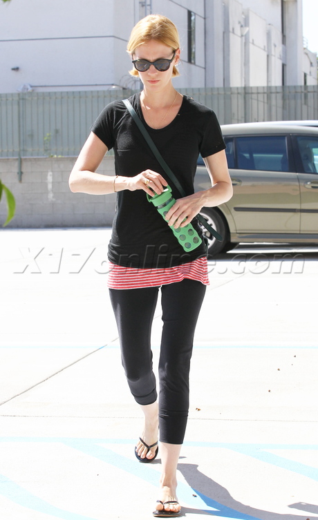 January Jones skinny sunglasses flip flops spandex tee shirt stripes yoga 
