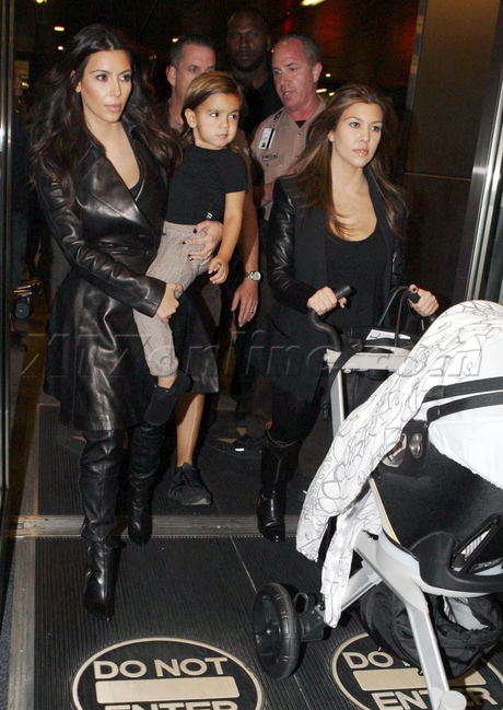 reality tv filming miami florida Kim Kardashian Kourtney Kardashian leather trench leather pants baby penelope mason 