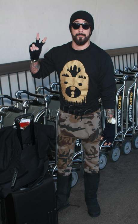 lax airport Aj Mclean tattoos peace sign 