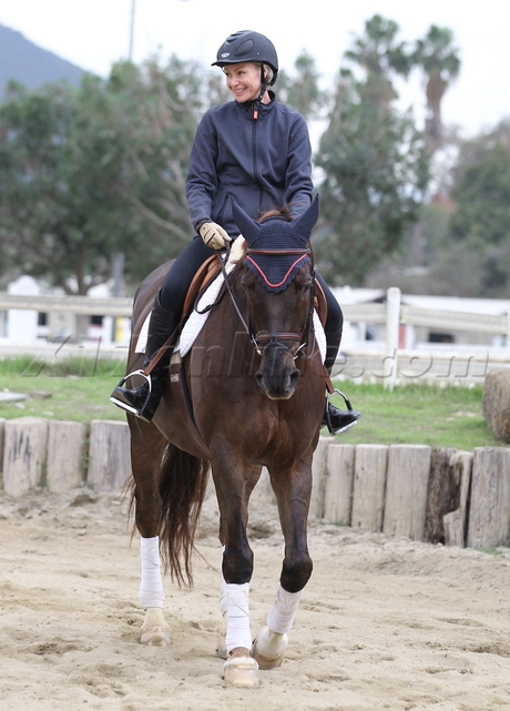 Portia de Rossi horse boots equestrian