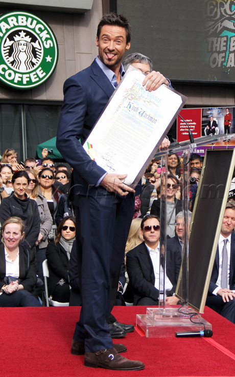 sunglasses purse heels tights walk of fame Hugh Jackman 