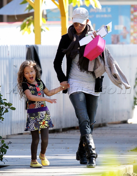Halle Berry boots jeans sunglasses running nahla hat scarf