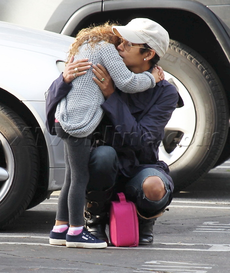 Halle Berry boots jeans sunglasses nahla hat scarf sad