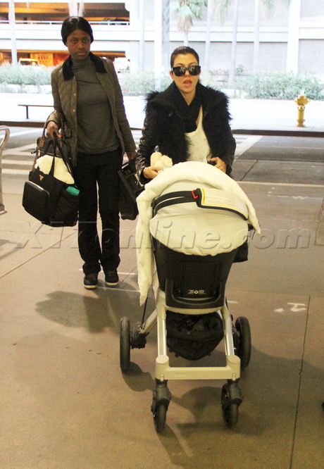 Kourtney Kardashian sunglasses stroller lax airport jacket baby 
