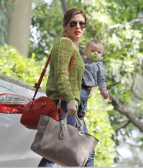 Hilary Duff sunglasses ripped sweater jeans baby pacifier 