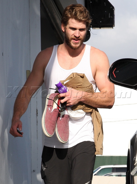 Liam Hemsworth tank top miley cyrus work out shorts beard 
