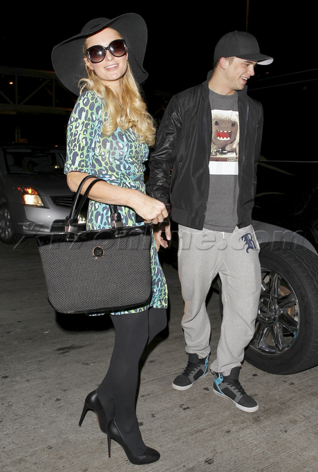 blonde sunglasses fashion smile airport Paris Hilton River Viiperi 