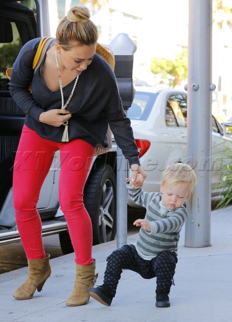 Hilary Duff red pants stripes necklace blonde boots lunch baby
