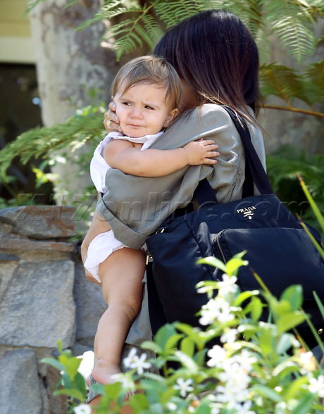 Kourtney Kardashian reality tv sunglasses jacket legs baby scott disick kim kardashian 